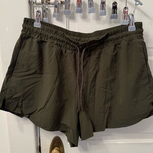 Athleta dark green running shorts
